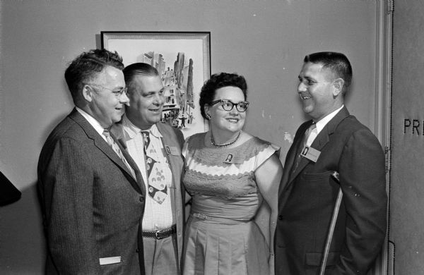 Donald Kinney (left), Fred Mick, Helen (Blazek) Richter, and Maynard Skuldt recall high school days at Central High School's Class of 1934 reunion.