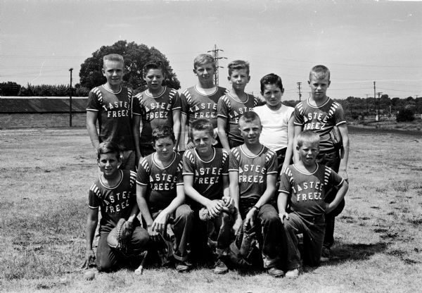 Group portrait of the Tastee Freeze team, champions of the East Midget Central No. 1 Baseball League. Front row left to right:  Ken Spraetz, Dick Scanlon, Mark Turner, Bob Rock, Jerry Currie.  Back row:  Bill McInvaille, Jack Ruppert, Doug Schultz, John Fetzer, Dick Gilbertson, Ken Koppenhaver.