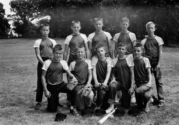 Group portrait of the Cuba Club's Midget Cherokee Champions. Their team won 19 out of 20 games to take that title, but lost in the playoffs. Left to right, front row:  Guy Solte, Greg Poole, Dave Porter, Dick Newell, Dan Fox; back row: Bob Hickman, Bill Goers, Bill Statz, Dick Busse, and Wade Brynelson.