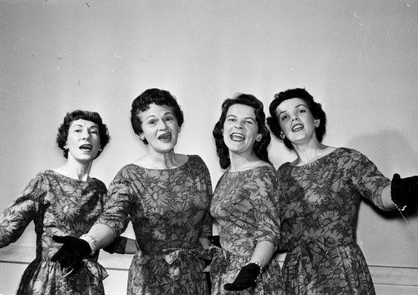 Group portrait of The Minorettes of Madison singing quartet including, from left to right: Dorothy Bleecker, baritone; Lee Sullivan, bass; Barbara Gschwend, lead; and Doris Howland, tenor.