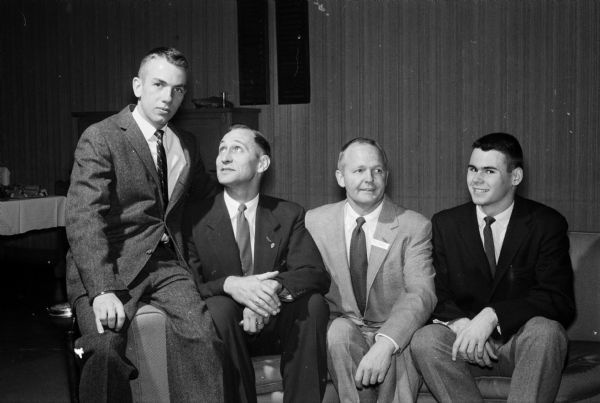 Club members and former athletes shown left to right are: Fred Miller, 1957; Harry Stoll, 1939; Paul Graven, 1939; and Jim Fisher, 1957.