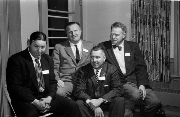 Four club members are shown at the Alumni W club's fifth annual meeting. They include, from left to right: Alex London, 1932; Circuit Judge Richard Bardwell, 1933; William Marling, 1936; and Roger Bardwell, 1942.