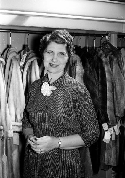 Mrs. Charles Carthright of Oregon was named the winner of "Parade Magazine's" election year contest to name the Republican elephant. Her winning entry was "Dauntless." Someone else named the Democratic donkey "Spunky." Mrs. Garthright is photographed at her job as manager of Mangel's Feminine Apparel, 25 S. Pinckney Street. The Cartrights will travel to the Riviera as their prize.