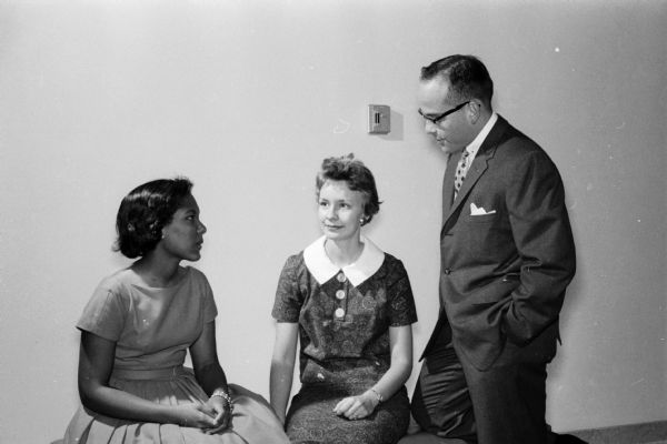 Dr. Sherwin Woods, guest speaker at the 12th annual Madison Youth Council Banquet, talking to two teenagers attending the banquet. Shown (left to right) are: Pat Hamilton, Bev Slauson, and Dr. Woods.