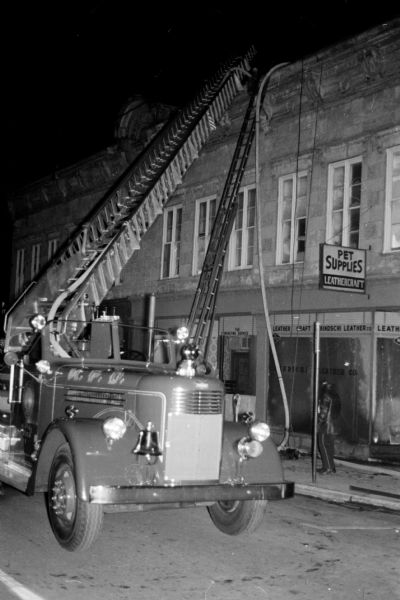 A stubborn fire smoldered in the walls of the Kindschi Leather Company at 120 South Pinckney Street. The 80-year-old building known as the Burrows building was formerly the Burrows Opera House.
