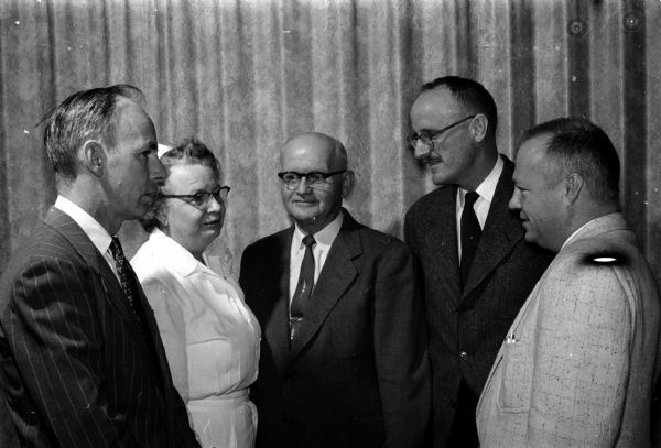 Shown in center is Gustave Pasicka, who is being honored as he retires from serving as a hospital aid at Mendota State Hospital. With him, at left, are: James Lynch and Janet Nusinoff. At right are: Dr. E.P. Peterson and Dr. Gilbert Tybring.