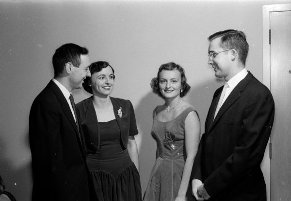 Dr. and Mrs. Albert Kanner, and Mrs. and Dr. Michael Lazor are shown at their club's annual holiday dinner dance.