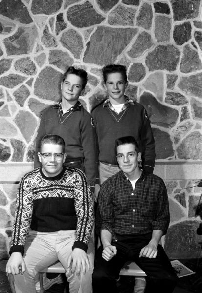 Group portrait of the Blackhawk Ski Club junior officers. In front row: Rees Thomas, president, and Chuck Stewart, vice-president. Back row: Ronald and Donald Jacobson, secretary and treasurer, respectively.