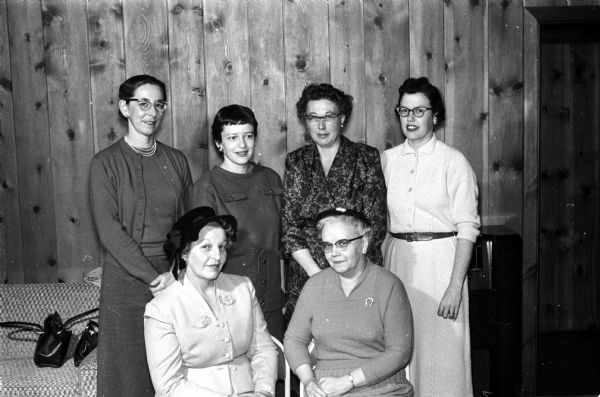 Officers of the Monona Village branch of the American Association of University Women are installed. Seated on the left is Mrs. James Hill, Jr., Baraboo, state president and installing officer; assisted by Mrs. Herbert Evans, on the right, state membership chairman. Standing left to right are: Kathleen Rueber, treasurer; Harriet Steil, vice-president; Mrs. Vernon Orton, president and Mrs. Durward Stevens, secretary.