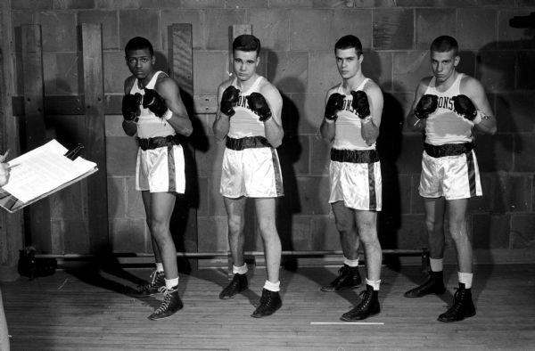 Terry Pitts, on the left at 147-pounds, is a younger brother of Orvill Pitts, NCAA light heavyweight champion from Wisconsin in 1956.