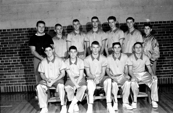 Group portrait of the Edgewood High School basketball team with coach Dave Brown and manager Mike Uselman.