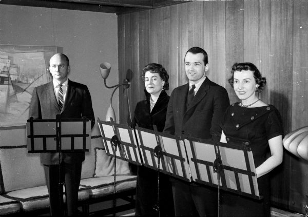 The University of Wisconsin Drama Quartet, sponsored by the University's Bureau of Lectures and Concerts, presents a musical biography of Richard Rogers. Pictured are Marvin Foster, the producer; Ruth Foster, casting director; Dave Matson and Lois Dick. For the hour-long production, the quartet consists of Al Barraclough, the narrator, with Ruth Foster, Dave Matson and Lois Dick singing selections from Roger's musical comedies.