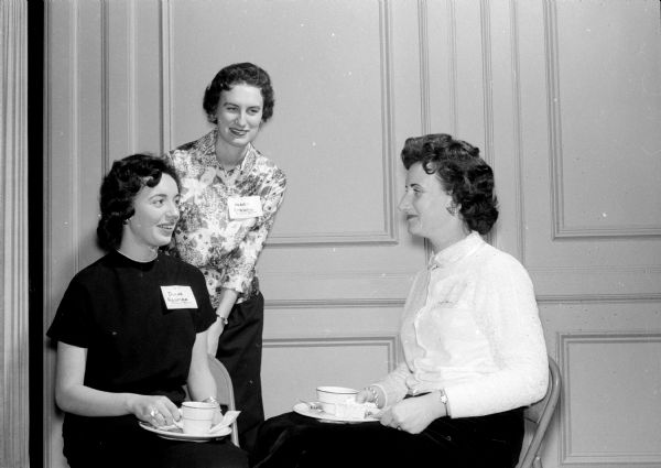 Guests at the Who's Who anniversary tea at the YWCA, 122 State Street include, left to right: Mrs. William Rouman, Mrs. Bruce Strong, and Charlene Meier.