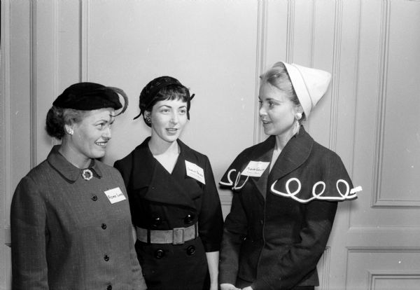 Guests at the Who's Who anniversary tea at the YWCA include, left to right: Roma Lang, Shirley French, and Mrs. Norman Goller.