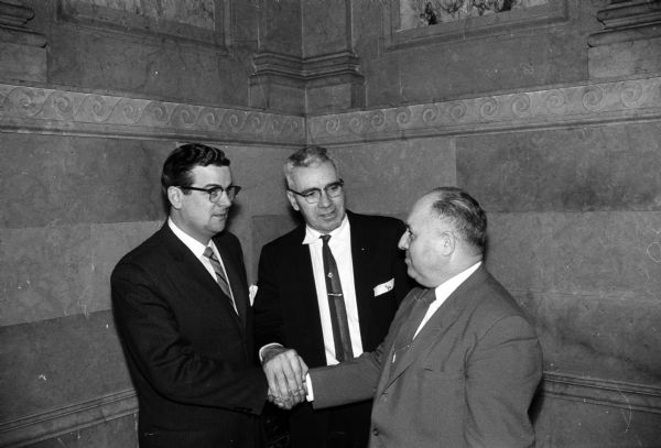 Group portrait of three Assembly Democratic leaders include, from left to right: Robert T. Huber, West Allis, speaker pro tem; Keith C. Hardie, Taylor, majority floor leader; and George F. Molilnaro, Kenosha, speaker of the house.