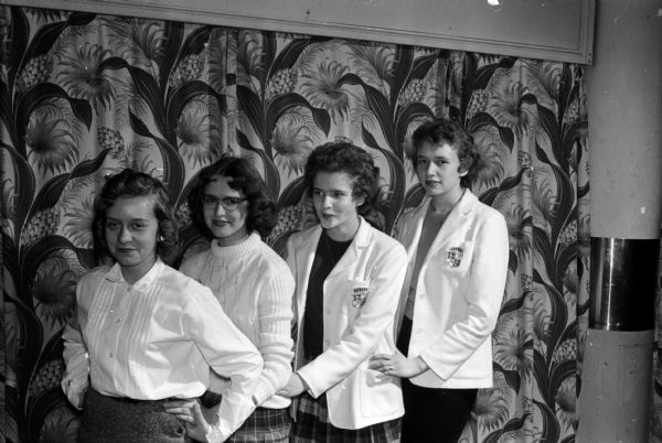 Activities at the Teen-Canteen at the YWCA, located at 122 State Street, are sponsored by the Junior High Y-Teen clubs in Madison. Here four of the teens pose together including, from left: Sandra Mehrkens, Tommie George, Diane John, and Judy Wopat.