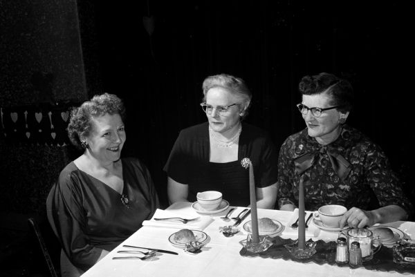 Portrait of three Elks Club wives who served as members of the ramp and wardrobe committee for the mother-daughter banquet and style show.
Left to right are: Mrs. Raymond (Kathryn A.) Werndli, 2142 Fox Avenue; Mrs. Richard (Harriett) Williams, 503 East Gorham Street, and Mrs. Charles (Marion) Russell, 5404 Flamingo Road.