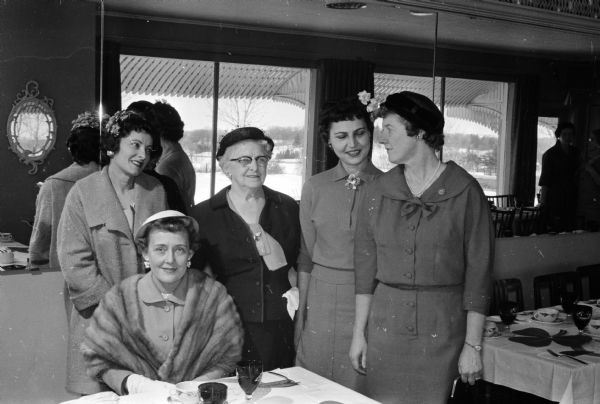 A sportsmanship award was made for the first time at the spring luncheon of the Ladies' Golf-Bowling League. It was awarded to Mary Brandel, standing second from left. Sitting is Georgia Nelson. Standing are Harriet Kelly, Mary Brandel, Dorothy Golden and Margaret Curtis.