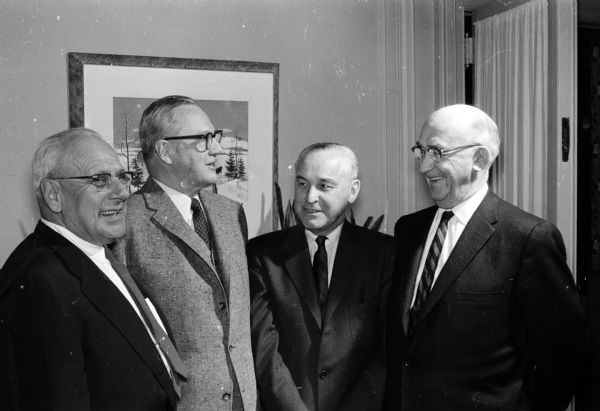 John Flad, Robert Sutherland, Dr. Walter J. Durkopp and Bert E. Miller, four charter members of the Madison Optimist Club, recall the organization date 35 years ago. Sutherland formerly was international president of Optimist Clubs and Miller was international vice-president.