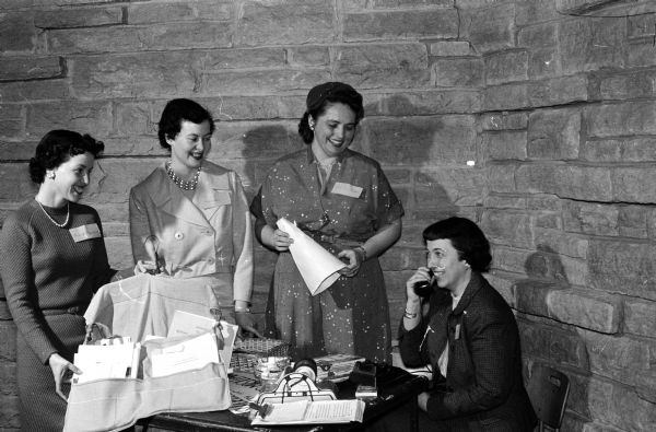 Four women taking part in a skit at the Madison League of Women Voters convention at the Unitarian Meeting House. Left to right are: Mrs. Mary Newgent, Mrs. Felice Goodman, Mrs. Rita Wlodarczyk, and Mrs. Mary Louise Symon.