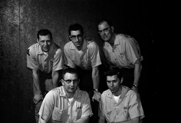 Group portrait of the Schoep's Ice Cream bowling team, winners of the team championship at the annual Madison Bowling Association tournament at Prairie Lanes in Sun Prairie. In front are LaVerne (Bing) Noltemeyer, left, and Phil Leighton. In back, left to right, are Bob Burmeister, Duke McDaniel, and Harry Helman.
