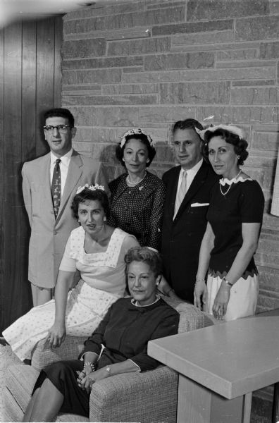 Group portrait of principals in the luncheon of the woman's division of the Madison Jewish Welfare Fund. Standing left to right: Robert Levine, Rose Glass, Dr. Morton Berman (speaker from Israel), and Rosalyn Sinaiko. Seated left to right: Rosella Elkind and Mary Sudow, who hosted the event in her home.