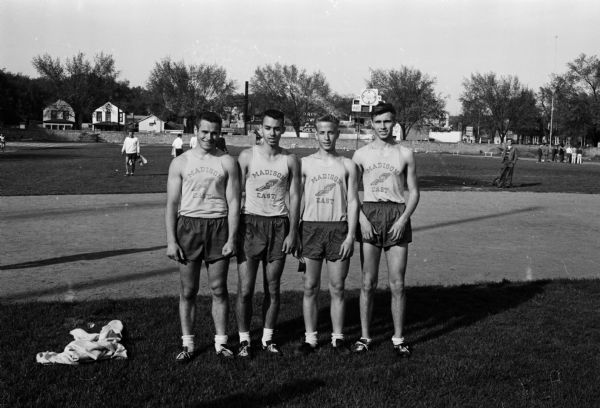 Terry Thor (left), Dave Blumerich, Ray Winborn, and Fred Lichte won the 880 yard relay for East High School.