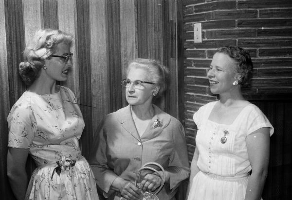 The Toastmistress Club celebrates its first year in Madison with a combination guest night and initiation of officers at the Cuba Club Supper Club. Shown (left to right) are Mrs. Dale Schmidt, Beaver Dam Toastmistress Club member; Mrs. Elsie Fansler; and Miss Esther Madsen, club secretary.