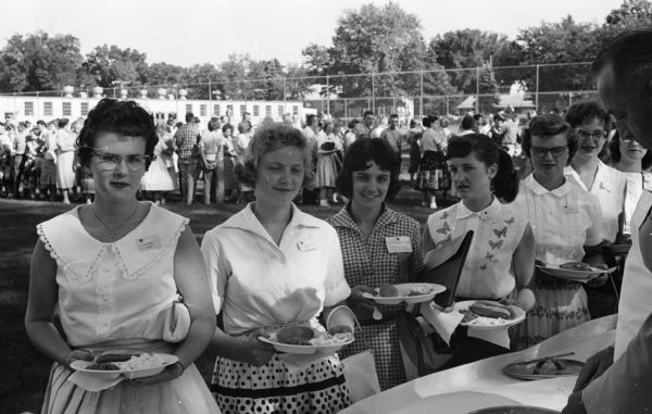 Some of the individuals attending the picnic for delegates at the Wisconsin 4-H Club conference are, left to right, Judy Rithamel, Walworth county; Lorraine Voight, Wood county; Barbara Rynders and Lynne Hunge, both of of Racine county.