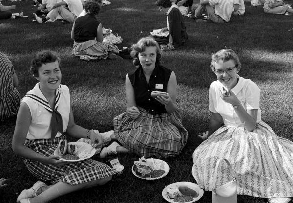 A picnic was held on the University of Wisconsin inter-mural field for delegates attending the Wisconsin 4-H Club conference and picnic. From left to right are: Karin Anderson, Sparta; Barbara Heeler and Lavonne Cook, both of Tomah.