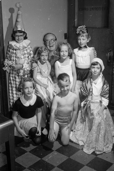 A neighborhood circus at 567 Park Lane, the Robert Munger residence, benefited "Roundy's Fun Fund."  Left to right in first row: Cheryl Eickner, Douglas Bower,Betsy Janceck. Left to right in second row: Mary Munger, Barbara Eickner, "Roundy" Coughlin, Mary Jo Eickner and Marilyn Bower.