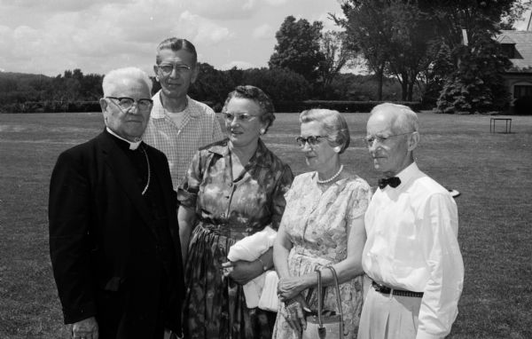 Bishop William P. O'Conner hosts more than a thousand members of the Madison Diocesan Council of Catholic Women and their families. Shown with Bishop O'Conner (left to right) are Mr. and Mrs. Roman Zens and Mr. and Mrs. John A. DeBeck.