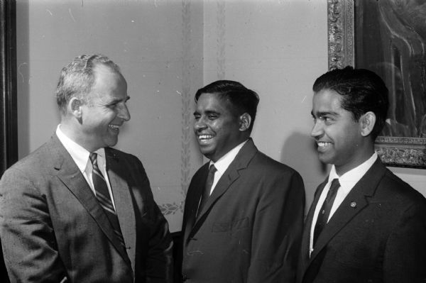 Two members of the University of Wisconsin's India Association smile their thanks to Governor Gaylord Nelson for "the wonderful hospitality extended toward the Indian students by the good people of Wisconsin." Shown (left to right) are Governor Nelson; V.S. Krishna, Hyderabad, India, president of the association; and A. Achyuthan, Kerala, India, secretary of the association.