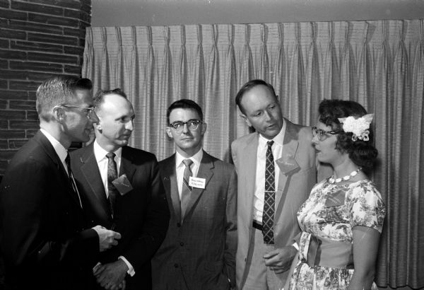 Members of the Wisconsin high school class of 1942 visit at the class reunion held at the Cuba Club in Madison. From left are: Boyer Harnerd, Waterloo, Iowa; Valentine Frank, Cross Plains; Dr. Sherman Nelson, Downey, Illinois; Robert C. Sweet, Columbia, Missouri; and Mrs. John Anderson, Crestwood, Missouri.