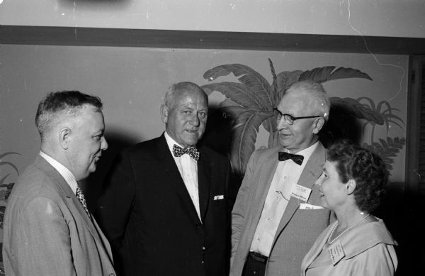 Madison Federal Court Judge Patrick T. Stone greets members of the Conference of United States Court Reporters at their convention at the Edgewater Hotel in Madison. Left to right are: John R. Adams, Madison; Judge Stone; Laurence E. Lindsey, Tulsa, Oklahoma; and Ruby M. Palmer, Pittsburgh, Pennsylvania.