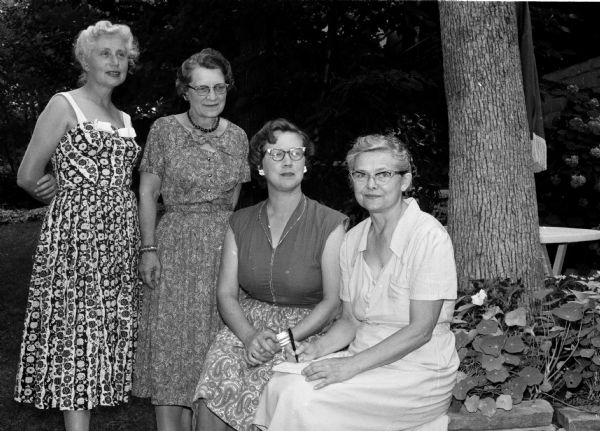 Members of the Little Garden Club plan a flower show. They include, from left, Alice Hutchins, Rachel Landphier, Barbara Barrett, and Lydia Shafer.