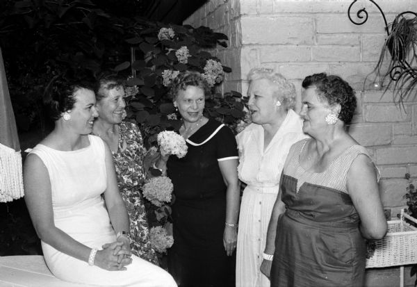 Little Garden Club members involved in the planning of a flower show include, from left to right: Elizabeth Reif, Edith Drives, Ruby Pearson, Mrs. C.E. Weinberg (Tulare, Calif.), and Dorothy Welch.