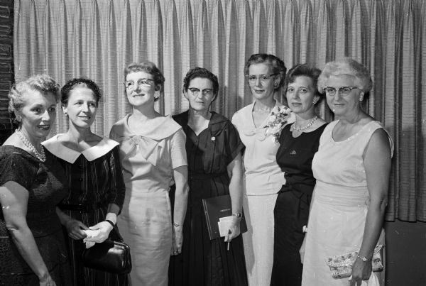 Portrait of seven women, all former students of pathologist Dr. Lester McGary. They are, left to right: Cleo Kreamer, Jane Worley, Evelyn Welch, Marion Smith, Helen Johnson, Arlene Hansen, and Ethel Trenary.