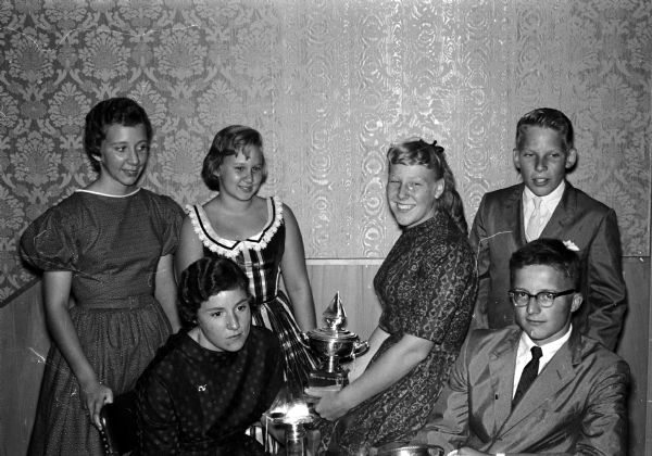 Six sailors who were successful skippers during the recent races of the Mendota Yacht Club were awarded trophies at the club's annual Commodore's Dinner, at the Maple Bluff Country Club. 
Left to right are:  Front--Barbara Mayer and John Rendall;  Back--Carlyn and Mary Mayer, Sue Henkel and Bill Jacobs.