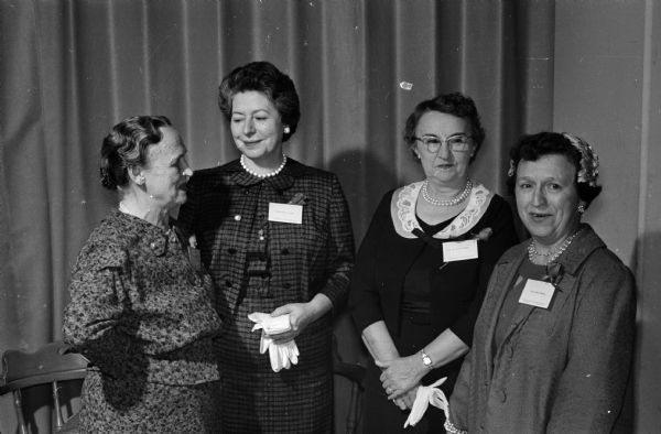 Sarah Murray (left), Helen Crahen, Alice Murphy, and Emma Huebel attend a recognition ceremony for non-academic employees of University Hospital who have worked more than twenty years or retired recently.