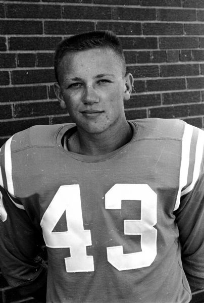 Portrait of Bill Guess, #43 on the Monona Grove High School football team. One of 49 images of individual members of the Monona Grove High School football team and the coaches John Klement, Frank Hlavac, Bob Jacobson and Gordon McChesney.