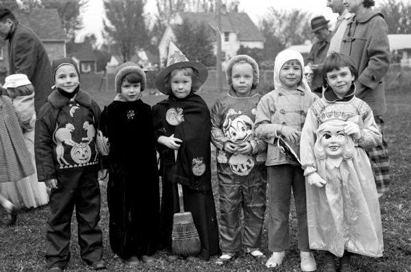 Children wore costumes while attending the Sunset Village Community Club Halloween Party. From left to right are Mary Moore, Nancy Shell, Jane Albert, Sharon Krantz and Erica Ohst.