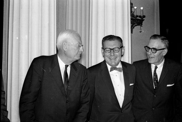 State and federal officials attend the Building Trades Apprenticeship banquet. Left to right: R.G. Knutson, state industrial commissioner, Clarence Greiber, state director of vocational education, and Alvin A. Dost, regional director of state bureau of apprenticeship and training of the U.S. Labor Department.