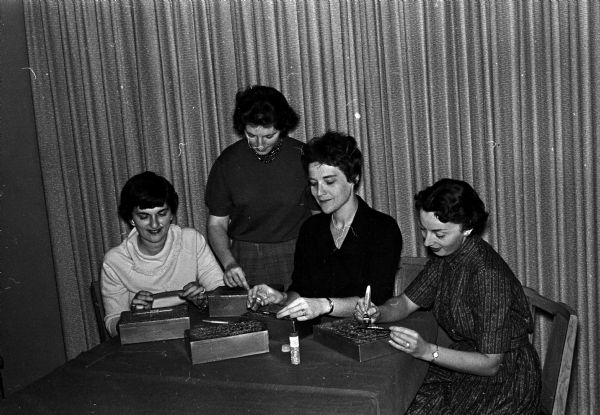 Four members of the Rachel S. Jastrow chapter of Hadassah work on decorations for the annual eye bank luncheon to be held at Temple Beth El. Left to right are: Mrs. Sheldon Thomas, Mrs. Sandra Schwartz, Mrs. Rochelle Levin, and Mrs. Shirley Botwinick.