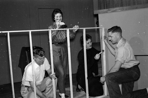 St. James Catholic Theater participants collaborate on set construction for John Willard's play, "The Cat and the Canary."  Left to right: Walter Kearns, Barbara Costello, Carol Jackson, and Joseph Gugel.
