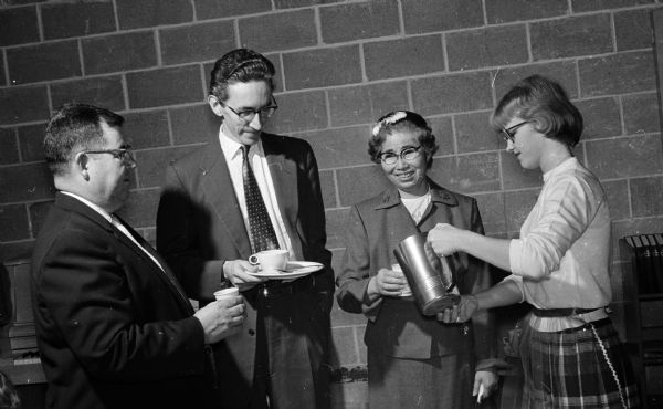 Hubert Ellison (left), William Shatter, and Tsurue Mita attend an open house of the new education wing of Bethany Methodist Church, 3910 Mineral Point Road. At right a Bethany youth, Mary Villemonte pours coffee.