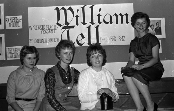 Drama Institute in Madison drew hundreds of high school thespians from all over the state. Members of the South Milwaukee High School Drama Club. Left to Right: Christl Fleischhacker, Marge Lenda, Sally Chapman, Judy Schilder. Poster advertises matinee performance of William Tell by Wisconsin Players.