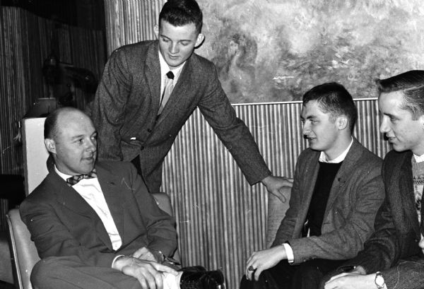 Visitors from South Milwaukee High School Drama Club attend the Drama Institute in Madison to watch a performance of <i>William Tell</i> by Wisconsin Players. Shown here: Principal Mark Druml of Green Lake High school with members of the National Thespian Society at his school. They are: Griff McDonald, David Egbert, and Ronald Hickey.