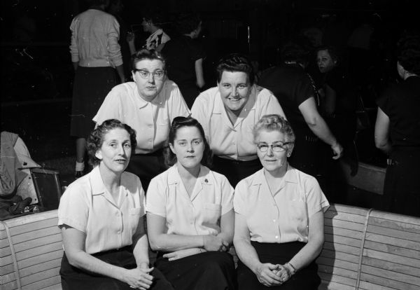 Portrait of the Dream Lanes team members that swept all honors in the Madison Woman's Bowling Association tournament. Seated, left to right, are Dee Fix, Audrey Geier, and Lorene Keefe. Standing are Doris Hanson (left) and Kelly Butterworth.