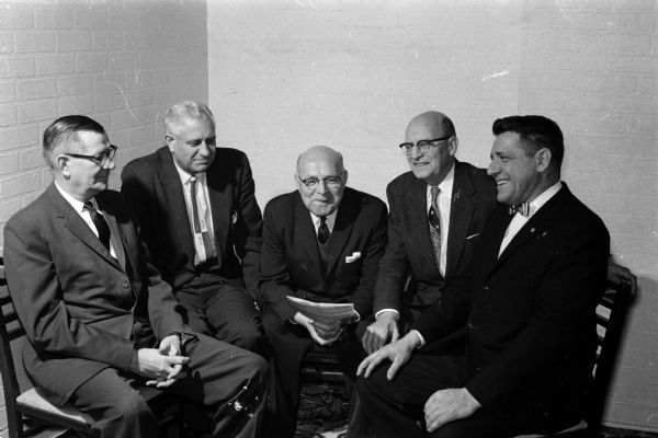 Five members of the West Side Business Men's Association meet to plan the group's installation night banquet. They were, from left: H.C. Weiss, Freeman Fox, Carl Reiss, Oscar Christianson, and James Pertzborn. The club was formed in 1942.